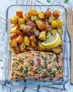 salmon and potatoes in a glass dish with a fork