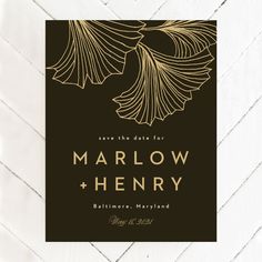 a black and gold save the date card with an elegant design on it's front