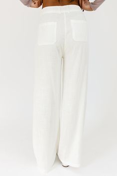 the perfect “go-with-anything” wide leg bottoms to elevate all of your summer outfit ideas. you can dress these off-white linen pants up or down for beach days, summer picnics, + date nights. off white // wide leg, one button zip fly, belt loops, pockets paired with our isabella top model is 5'10" + wearing a small measurements are approximate + taken while laying flat small : waist 26” inseam 30.5” length 42” medium : waist 28” inseam 31” length 42.5” large : waist 30” inseam 31” length 43" mor White Linen Pants For The Beach, White Linen Pants For Beach, White Cotton Wide Leg Pants For Day Out, White Wide Leg Pants With Pockets For Beach, White Wide Leg Vacation Pants With Pockets, White Wide Leg Vacation Pants With Elastic Waistband, White Wide Leg Pants With Pockets For Vacation, White Wide Leg Pants With Elastic Waistband For Vacation, White Cotton Wide Leg Pants For Vacation