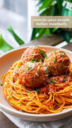 spaghetti with meatballs and tomato sauce in a white bowl