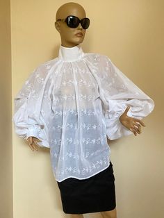 "This is a very stylish Womens Cotton Blouse. It is comfortable and cozy. Made for a free flowing fit. Great for all year around and for any special occasion or casual day can be dressed up or dressed down. SIZE CHART SIZE S - US 6, UK 8, EU 36 bust: bust around 34.5\"/90cm Waist: waist around 27.5\"/70cm Hips: hips around 34.5\"/90cm SIZE M - US 8, UK 10, EU 38 bust: bust around 37.5\"/95cm Waist: waist around 29.5\"/75cm Hips: hips around 37.5\"/95cm SIZE L - US 10, UK 12, EU 40 bust: bust aro Classic Floral Embroidered Tops For Daywear, Fitted Shirt With Floral Embroidery For Daywear, Traditional White Blouse For Fall, Elegant Cotton Embroidered Top For Daywear, Fitted Elegant Top With Chikankari Embroidery, Long Sleeve Blouse With Chikankari Embroidery For Daywear, Classic Embroidered Tops For Spring, Elegant Long Sleeve Embroidered Top For Daywear, Embroidered Blouse For Daywear