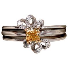 Fancy Yellow Cluster Ring .48ct. Natural Yellow Diamond cushion Cut Si-1 clarity 4 X 4.3mm Side diamonds: .10ct. rounds, Full cuts. H-color Vs2 clarity 14kt. white gold 4.4 grams Ring Current size: 8.5 Rings have been permanently fused together $6000 Appraisal Certificate to accompany Formal Yellow Diamond Ring With Single Cut Diamonds, Yellow Single Cut Diamond Rings For Anniversary, Formal Yellow Diamond Ring With Single Cut, Formal Yellow Rings With Single Cut Diamonds, Yellow Rings With Single Cut Diamonds For Anniversary, Formal Yellow Diamond Platinum Ring, Formal Yellow Platinum Diamond Ring, Yellow Platinum Diamond Ring Gift, Formal Yellow Platinum Rings