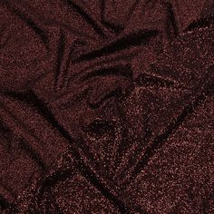 It's always time for rich jewel tones like this Gala Burgundy Double-Faced Glitter Tulle! A wine-red tulle base is adorned with burgundy glitter on both sides, with one side showing a finer glitter than the other. The crisp hand and weighted drape make it an excellent choice for evening gowns, skirts, ball gowns, and bold capes, or use it for special occasion dresses, such as for weddings or quinceañeras. Opaque, a lining can be used for comfort if desired. Glamorous Glitter Tulle Fabric For Evening, Glamorous Glitter Sequin Fabric For Club, Elegant Glitter Tulle Fabric, Red Glitter Sequin Fabric For Festive Occasions, Red Glitter Fabric, Rich Jewel Tones, Glitter Fabric, Jewel Tones, Wine Red