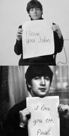 two people holding up signs that say i love you john and i love you too paul