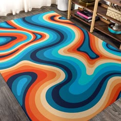 a colorful area rug in the middle of a living room with a book shelf and bookshelf