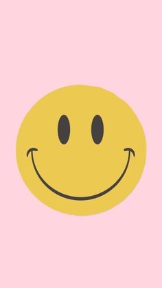 a yellow smiley face on a pink background