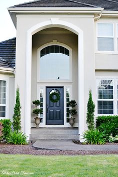 a house with a wreath on the front door