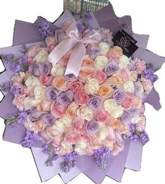 a large bouquet of flowers in pastel colors