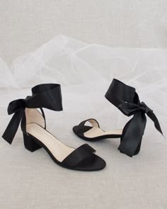 Classy satin block heel with satin ribbon ankle tie. Simple yet¬†elegant¬†are¬†great combination and will definitely be a favorite.DETAILS:HEEL HEIGHT: 1.25 inches (kids) & 2 inches (women)RIBBON WIDTH: 1.5 inchesUPPER: Synthetic upper and liningMATERIALS: Manmade outsoleORIGIN: Imported Small Heel Shoes Black, Black Heels For Wedding Bridesmaid, Shoes For Black Prom Dress, Fun Black Heels, Black Bridesmaids Shoes, Black Ribbon Heels, Prom Shoes Small Heel, Black Heels Small Heel, Small Heels For Prom