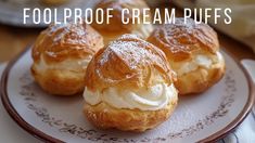 three cream puffs on a plate with the words foolproof cream puffs