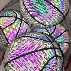 several basketballs are stacked on top of each other