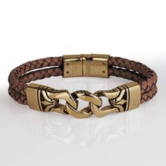 This stylish men's bracelet features a braided genuine brown leather strap with premium grade 316L solid stainless steel, fused with an 18k yellow gold finish. Fits up to an 8" wrist, magnificent presentation case included. Timepieces International Luxury Brown Men's Jewelry, Luxury Brown Bracelets With Polished Finish, Luxury Brown Adjustable Bracelet, Luxury Brown Leather Bracelet, Luxury Hand-tooled Brown Bracelet, Mens Bracelet Black, Brown Bracelet, Brown Leather Strap, Black Bracelets