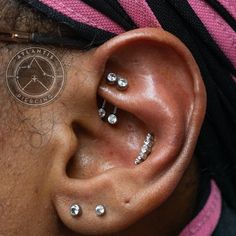 a woman with piercings on her ear