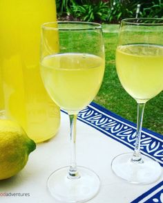 two glasses of lemonade sit on a table