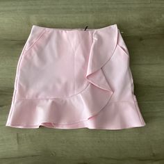 New Polo Golf Ralph Lauren Flounce Solid Pink Ruffled Skort Skirt Womens Sz S. This Golf Skort Is Crafted From A Moisture-Wicking Cotton Blend To Keep You Cool And Comfortable On The Links. The Flounced Silhouette Receives A Dose Of Feminine Style Through The Ruffle Trim At The Front And The Hem. 2 Angled Hand Pockets And 2 Back Welt Pockets Attached Short Pull On Shell: 90% Nylon, 10% Elastane. Lining: 88% Polyester, 12% Elastane. Please Check My Other Great Items Smoke And Pet Free Home Ruffled Mini Skirt For Workwear, Ruffled Mini Skirt For Work, Workwear Ruffled Mini Skirt, Spring Workwear Ruffled Mini Skirt, Workwear Mini Skirt With Ruffles, Spring Ruffled Mini Skirt For Work, Feminine High Waist Lined Skort, Feminine High-waist Lined Skort, Pink Mini Length Bottoms For Work