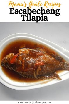 a white plate topped with fish covered in sauce