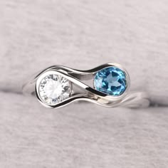 ◆ The ring is handcrafted from sterling silver and decorated with a dazzling 5*5 mm Swiss blue topaz and CZ. It is suitable for engagement/anniversary/daily occasion. ◆ Production Description: Main stone Type: Real Swiss Blue Topaz and Cubic Zirconia (2 stones can change to what you want) Main Stone Shape: Round Cut Main Stone Size: 5*5 mm(0.57ct & 0.88ct) Side stone: None Metal: 925 Sterling silver - Other options available in the drop down menu ◆ Customization: √Free for Add Engraving √Other M Fine Jewelry Blue Topaz Ring With Tension Setting, Blue Topaz Ring With Tension Setting, Fine Jewelry Blue Topaz Ring In Diamond White, Diamond White Blue Topaz Ring Fine Jewelry, Diamond White Blue Topaz Ring For Gifting, Fine Jewelry Topaz Ring With Tension Setting For Anniversary, Diamond-encrusted Topaz Birthstone Ring For Anniversary, Sterling Silver Topaz Ring With Accent Stones For Promise, Diamond Topaz Ring With Birthstone For Anniversary