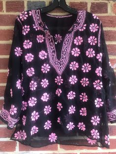 "Pit to pit 22\"Extra room measures 22 Side Straight down measure 20\"/sleeve length about 19\"/Length 24 1/2\" /Smoke free environment/Side slits 6 1/2\"/embroidered tunic top/clean no /Button down front/appears to be hand embroidered/ good vintage condition/Last 3 pictures show the backside proving it is hand embroidered.You can see the spread from one flower to the other. This shirt has a lot of work into it (9)" Bohemian V-neck Top With Resham Embroidery, Traditional V-neck Top With Chikankari Embroidery, Spring V-neck Blouse With Block Print, Festive Pink Tops With Chikankari Embroidery, Casual Long Sleeve Tops With Resham Embroidery, Festive Multicolor Casual Tops, Casual Long Sleeve Blouse With Resham Embroidery, Floral Print Summer Festive Tops, Spring V-neck Block Print Blouse