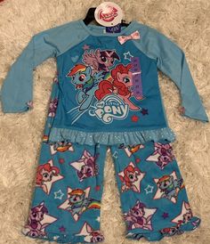 8H(2) BTN Outlet LLC My Little Pony Girls' 2pc Long Sleeve Pajama Set Fleece Flame Resistant Blue Size: 3T or 4T *Please select your size from the drop-down menu* Condition:  New with/without Tags. Most do come with tags, but some may have been removed during handling. *Fit: We cannot guarantee an item will fit you because each manufacturer's sizes and fits are different.  We try to provide reference sizes as a guide and only a guide. Please check with the actual brand company for more reference Playful Blue Sets For Fall, Blue Character Print Long Sleeve Sets, Blue Long Sleeve Sets With Character Print, Blue Playtime Sets For Fall, Cute Multicolor Winter Sets, Plastic Hangers, Reference Pictures, Company Branding, Long Sleeve Pyjamas