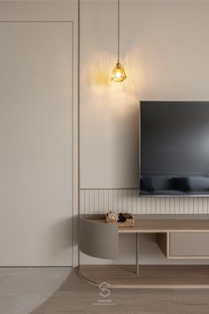 a flat screen tv mounted to the side of a wall