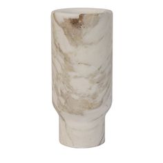 a white marble vase sitting on top of a table