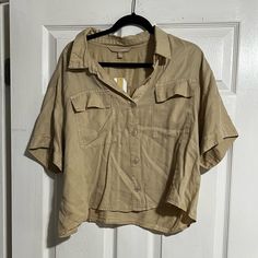 Tan Appraisal Versona Cropped Button Up Top. Never Worn With Tags. Size Xl. Tan Button Up, Khaki Button-up Tops With Buttoned Pockets, Casual Khaki Blouse With Buttons, Khaki Button-up Blouse With Pockets, Beige Short Sleeve Blouse With Button Closure, Casual Collared Top With Back Button Closure, Beige Blouse With Button Closure And Short Sleeves, Khaki Tops With Button Closure For Day Out, Collared Tops With Buttoned Pockets For Day Out