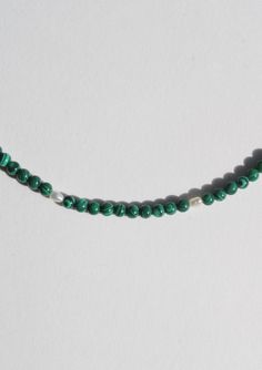 Another addition to our coveted strands of beads. A string of tiny malachite beads, seed pearls and finished with a 14 karat gold ball clasp. Measures 16" long Malachite Gemstone Bead Necklaces, Malachite Gemstone Beads Necklace, Beaded Green Onyx Round Beads Necklace, Green Onyx Beaded Round Necklaces, Green Onyx Beaded Necklaces, Beaded Malachite Round Bead Necklaces, Dark Green Beaded Jewelry With Round Beads, Handmade Emerald Beaded Necklaces With Round Beads, Polished Malachite Round Beaded Necklaces