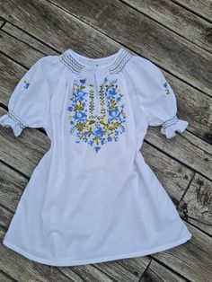 Traditional Hungarian Matyó floral handembroidered blouse . This blouse is new. Peasant blouse, colorful peasant blouse, embroidered blouse, embroidered peasant blouse, floral blouse, ethnic embroidered blouse Beautiful wide shape boho, hippie, folk blouse with floral embroidered pattern.  Handmade blouse  Length: 26" Bust : 44 - 45"  inch Hand wash only. If you are buying several pieces I can combine postage at the time of mailing. If you have any question please don't hesitate to contact me, Folk Style Peasant Tunic Top With Floral Embroidery, Folk Style Peasant Top With Floral Embroidery, Summer Folk Peasant Top With Embroidered Sleeves, Peasant Style Tunic Top With Floral Embroidery, Summer Peasant Blouse With Embroidered Sleeves, Fitted Floral Embroidery Tunic Blouse, Fitted Tunic Blouse With Floral Embroidery, Peasant Blouse With Embroidered Sleeves For Summer, Summer Peasant Blouse With Embroidered Neckline