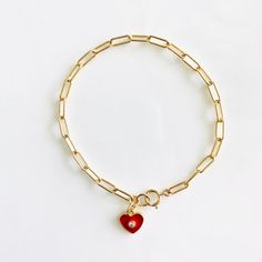 Loving these new heart charm bracelets. Something about them reminds me of the playfulness of childhood, but with an updated elegant (and adult) twist. These enamel charms are available in red, light pink, white, and black, and are all accented with a cubic zirconia. Charm also available in a cubic zirconia heart. If you like the looks of how some are styled in the pictures with multiple charms, please contact me for a customizable bracelet. Otherwise, each bracelet comes with 1 charm. Charms ar Heart-shaped Jewelry With Removable Charms For Valentine's Day, Red Heart Charm Bracelet For Friendship, Red Heart Charm Jewelry For Friendship, Adjustable Red Heart Charm Bracelet, Valentine's Day Gift Chain Bracelet With Lobster Clasp, Personalized Red Heart Bracelet, Red Charm Bracelet With Heart Beads For Gift, Red Heart Beads Charm Bracelet For Gift, Red Heart Bracelets For Friendship