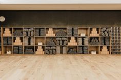 a room filled with lots of boxes and stacks of tires on top of wooden shelves