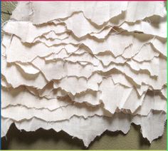 an image of torn paper on the wall