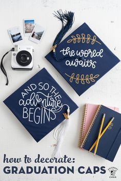 two graduation caps with the words and so the adventure begins on them next to some other items