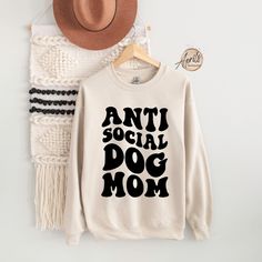 Antisocial Dog Mom Sweatshirt, Dog Mom Sweatshirt, Dog Mom Gift, Dog Lover Gift, Dog Mama Sweatshirt, Dog Mom Crewneck, Antisocial Shirt CAUTION: For security reasons, there is no rope in the throat area for youth hoodie. Hello!! Dear Customer, We're here to give you best Dog Mom sweatshirt, hoodie and crewneck options for you. We want to make everyone smile with our cute, stylish and trendy graphic shirts. We can assure you this shirt will be perfect Dog Mom sweatshirt, hoodie and crewneck gift Long Sleeve Cotton T-shirt With Dog Print, Cotton Long Sleeve T-shirt With Dog Print, Cotton T-shirt With Dog Print For Fall, Fall Cotton Sweatshirt With Dog Print, Cotton Dog Print Sweatshirt For Fall, Casual Crew Neck Sweatshirt With Dog Print, Winter Cotton Sweatshirt With Dog Print, Security Shirt, Dog Mama Shirt