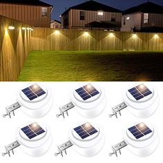 six solar powered lights on the side of a fence and in front of a yard