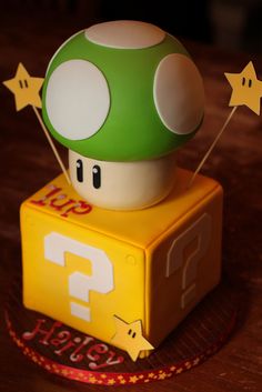 a toy mushroom sitting on top of a yellow box with stars around it's edges