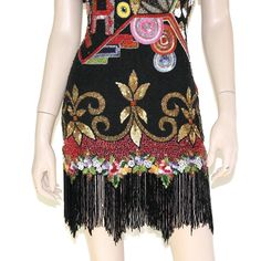 "This 80s-era silk trophy dress from Naeem Khan - Riazee features a stunningly sequined & beaded pop art design, beaded zig-zag fringe on sleeves and hemline, keyhole back, and mini length skirt. Luxuriously well-made and ready to turn heads! Dress is fully lined, has removable shoulder pads, and zips up the back. Best fits size xs or small (please check measurements below). Accessories not included. Payment plans available. Approximate Flat Measurements: Multiply times 2 for bust, waist, an Embellished Flapper Dress For Summer Costume Party, Summer Embellished Flapper Dress For Costume Party, Fitted Beaded Fringe Flapper Dress For Party Season, Fitted Embellished Mini Dress For Festival, Bohemian Sequin Mini Dress For Party, Bohemian Flapper Dress With Sequins For Party, Bohemian Flapper Dress With Beaded Fringe For Party, Bohemian Embellished Flapper Dress For Party, Glamorous Beaded Flapper Dress For Party Season