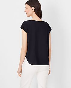 Embrace effortless elegance with the Ann Taylor Petite Boatneck Top, tailored specifically for a refined look. This top is perfect for those who appreciate a blend of comfort and style in their everyday wear.

- Size: Petite 2XS
- Color: Black
- Gender: Female
- Material: 100% Polyester
- Fit: Blousy - our most relaxed fit
- Length: 22 1/2" long
- Features: Boatneck, short sleeves, shirttail hem
- Care Instructions: Machine washable

Designed for the modern woman, this top features a classic boa Black Short Sleeve Top For Spring Workwear, Black Short Sleeve Top For Summer Workwear, Elegant Crew Neck Top With Relaxed Fit, Elegant Relaxed Fit Crew Neck Top, Casual Crew Neck Top In Viscose, Casual Viscose Crew Neck Top, Chic Tops For Layering With Relaxed Fit, Chic Relaxed Fit Tops For Layering, Casual Short Sleeve Tops In Viscose