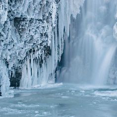 an icy waterfall with icicles on it