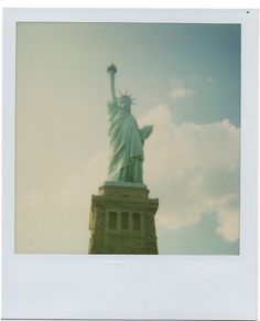 an old photo of the statue of liberty