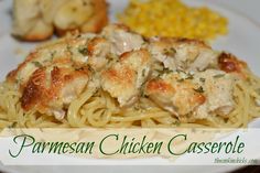 a white plate topped with pasta and chicken