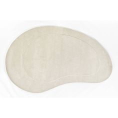 an oval shaped rug with a white background