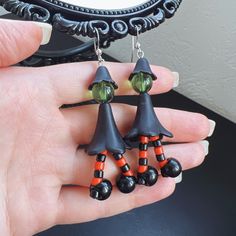 Wonderful Halloween witch dangle earrings. Length: 2.75 inches / 7 cm. Handmade Witchy Earrings For Halloween, Witchy Halloween Earrings, Handmade Witchy Dangle Earrings, Handmade Spooky Black Earrings, Whimsical Black Drop Earrings, Witchy Drop Earrings, Handmade Dangle Earrings For Halloween, Beaded Dangle Earrings For Halloween, Dangle Beaded Earrings For Halloween