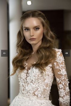 a woman with long hair wearing a wedding dress