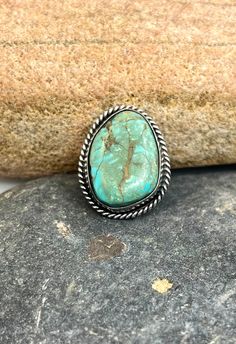 Vintage Navajo Sterling Silver Natural Untreated Turquoise Statement Ring 7.25 Orders totaling $100 and up include an anti-tarnish treated velvet jewelry pouch!  Ring is a size 7.25 Face of ring measures approximately 1 1/8" X 1" Weighs approximately 9 grams Condition: Pre-owned, the stone isn't cracked. It's natural inclusions Metal: Sterling silver No stamp, electronically tested with a Niton DXL precious metal analyzer to guarantee sterling silver Comes in a gift box! This item is in used con Southwestern Turquoise Ring With Large Stone, Southwestern Style Turquoise Ring With Large Stone, Southwestern Style Large Stone Turquoise Ring, Bohemian Turquoise Concho Ring, Adjustable Southwestern Turquoise Ring With Natural Stones, Southwestern Turquoise Concho Ring As A Gift, Southwestern Style Turquoise Concho Ring As Gift, Western Style Turquoise Gemstone Rings, Turquoise Concho Ring As Gift