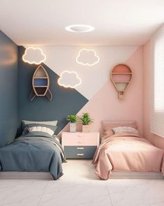 two beds in a room with pink and blue accents on the walls, one bed has a small nightstand next to it