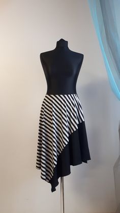 "Lightweight single jersey black and grey striped skirt with a monochrome black decor. The skirt doesn't have a front and back, you can choose your way how to wear it.  CUSTOM made to your size when ordering please indicate your waistline measurement. Currently one in stock in size M for 75cm (30\") waistline." White Asymmetrical Skirt With Lining, Fitted Asymmetrical Gathered Skirt, Asymmetrical Fitted Gathered Skirt, Asymmetrical Pleated Fitted Skirt, Asymmetrical Fitted Pleated Skirt, Fitted Gathered Skirt With Asymmetrical Hem, Asymmetrical White Relaxed Skirt, Fitted A-line Wrap Skirt With Lining, Fitted A-line Wrap Skirt Lined