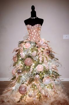 a dress made out of fake fur with lights on the bottom and ornaments all over it