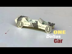 money origami car made out of one dollar bill