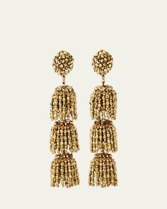 Oscar de la Renta earrings    Approx. 1.4"L x 3.5"W    Goldtone brass    Glass and plastic beads    Clipon backs with comfort pads    Spot clean    Imported Beaded Evening Earrings, Elegant Polished Beads Earrings For Party, Elegant Party Earrings With Polished Beads, Gold Beaded Drop Clip-on Earrings, Gold Beaded Drop Earrings For Evening, Gold Drop Beaded Earrings For Evening, Gold Beaded Earrings With Dangling Beads For Evening, Festive Gold Beaded Chandelier Earrings, Bronze Beaded Brass Earrings