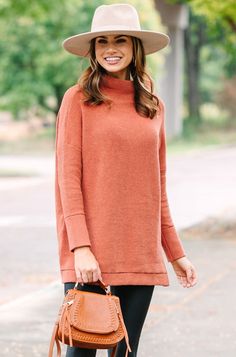 This wide mock neck tunic is the exact point at which style and comfort meet! The length is perfect for pairing with leggings which only adds to the comfort. We also love that you can dress this look up or down by pairing with boots/booties or sneakers depending on what your day looks like! Wide mock neckline Long sleeves with drop shoulders Ribbed fabric Oversized fit Fair stretch Savannah is wearing the small. Floral Cocktail Dress, Black Tie Dress, Girl's Back, Girls Graphic Tee, Cute Rompers, Sweater Tank Top, Rust Orange, Mock Neckline, Girl Sweatshirts